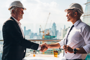 Man hiring a contractor shaking hands